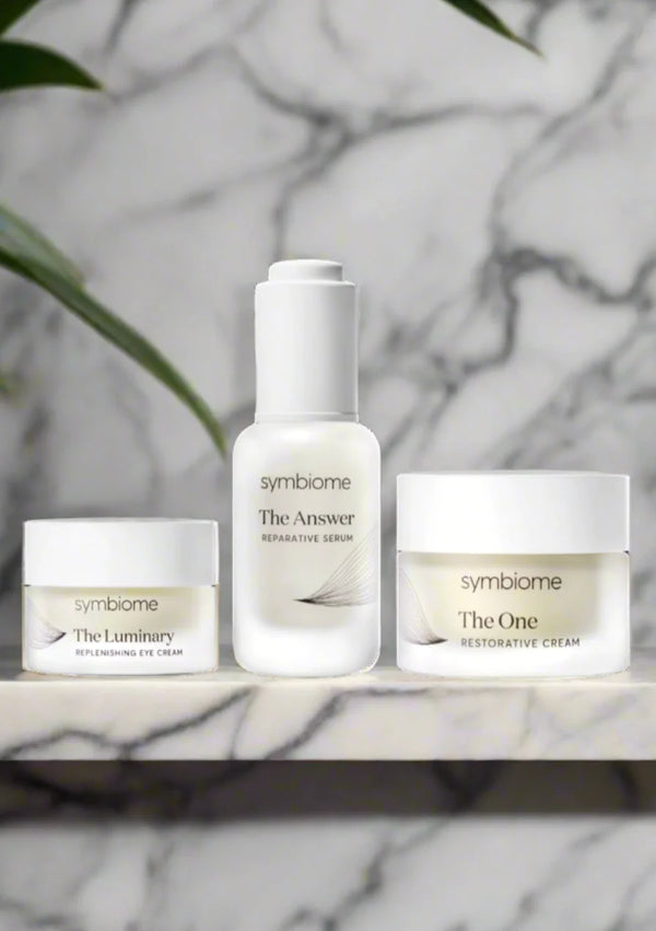 Symbiome's Treatment Trio: serum, eye cream, moisturizer for glowing skin.